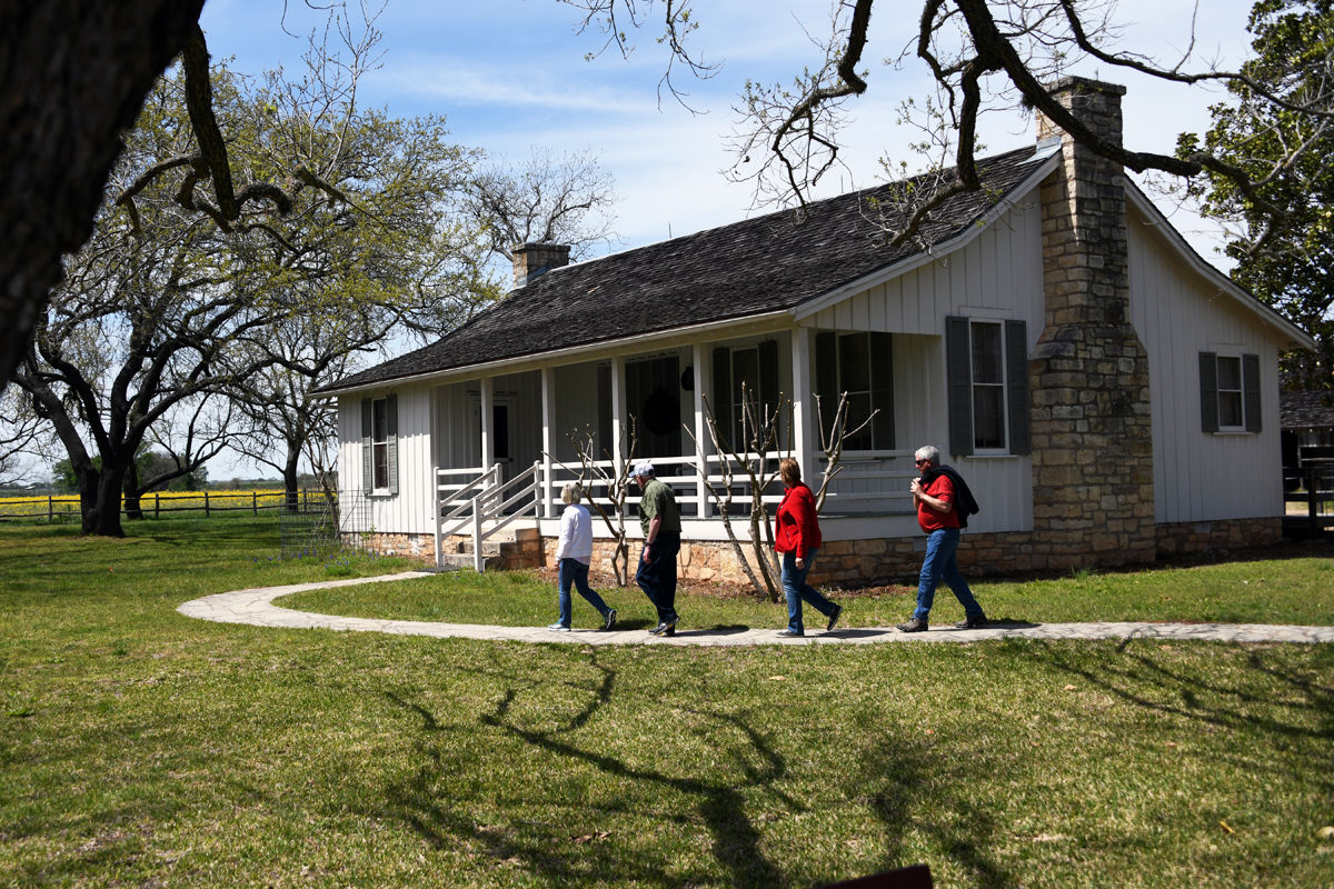 205 The Klutes and the Driewers on their way to visit the re-created birthhome of LBJ.JPG